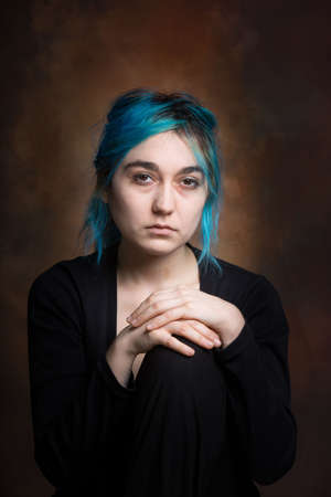 photo of young woman expressing melancholy, sadness, reflectionの写真素材