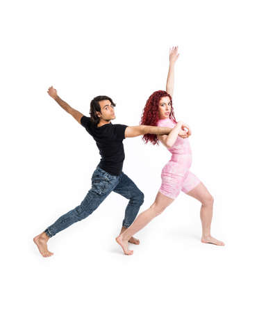 Boy and girl dancing on white backgroundの写真素材