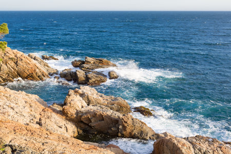 Rocks and cliffs on the Costa Brava in the Mediterranean Sea in northern Catalonia, Spain.の写真素材