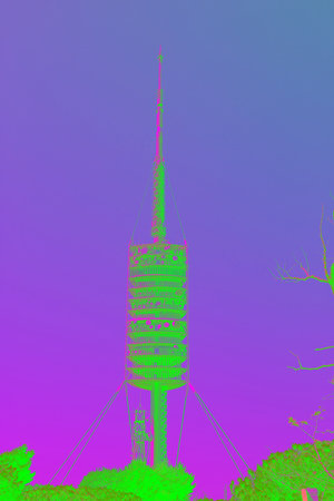 Torre de Collserola telecommunications tower is standing tall over the city of Barcelona, Spainの写真素材