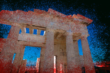 The Erechtheion, an ancient Greek temple located on the Acropolis in Athens, Greece, showcases its architectural marvel against a vibrant blue skyの写真素材