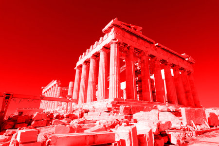 Tourists and guides visiting the parthenon on the acropolis of athens, greece, during restoration worksの写真素材
