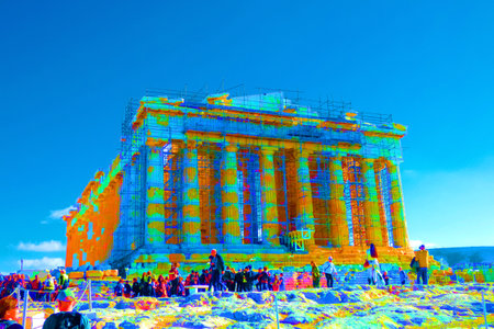 Tourists and guides visiting the parthenon on the acropolis of athens, greece, during restoration worksの写真素材