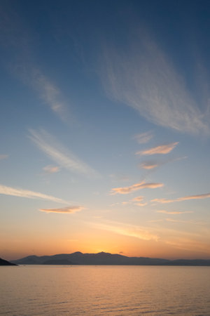 A beautiful sunset sky filled with colorful cloudsの写真素材