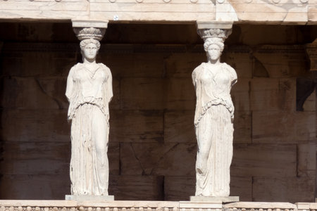 Caryatids, female draped figures, serving as supporting columns of the erechtheion, an ancient Greek temple on the north side of the acropolis of Athensの写真素材