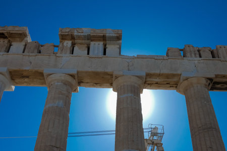 Tourists and guides visiting the parthenon on the acropolis of athens, greece, during restoration worksの写真素材