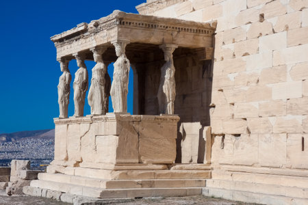 Caryatids, female draped figures, serving as supporting columns of the erechtheion, an ancient Greek...