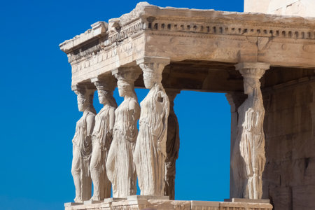 Caryatids, female draped figures, serving as supporting columns of the erechtheion, an ancient Greek temple on the north side of the acropolis of Athensの写真素材