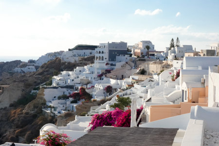 White painted houses and blue domed churches creating a picturesque cityscape in Oia, Santorini, Greeceの写真素材