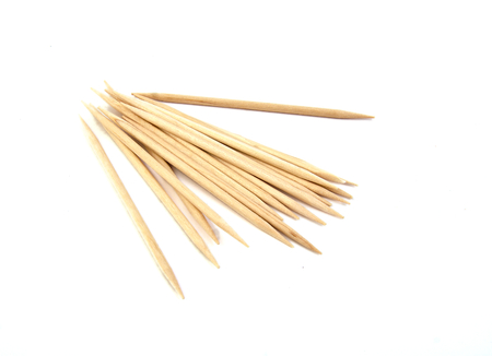 Bunch of brown toothpicks on white backgroundの写真素材