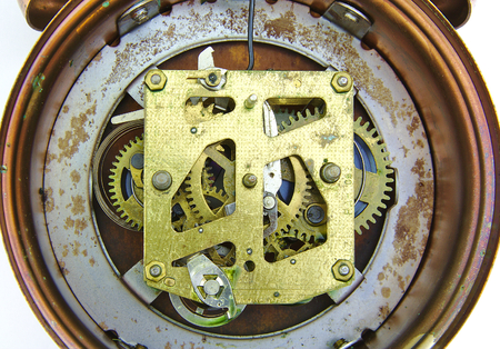 Alarm clock inside mechanism on white background
