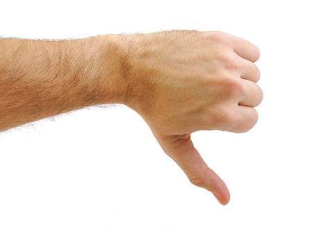 Hand with a thumb down gesture isolated on white background. Rejection symbol
