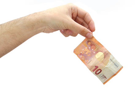 Caucasian hand holding a ten euros banknote isolated on white backgroundの写真素材