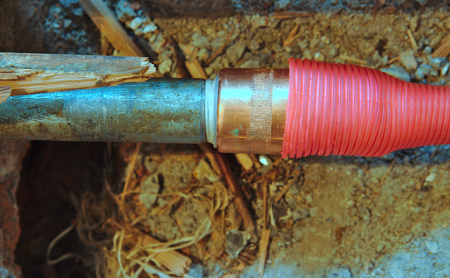 Hot water pipe on a broken floor