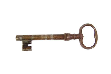 Antique key isolated on a white backgroundの写真素材
