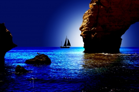 Coast view with a boot and moonlightの写真素材