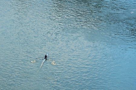 Man training for an individual rowing competitionの写真素材