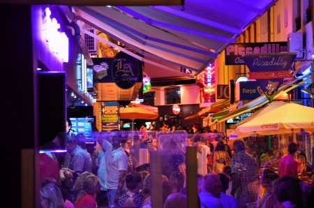 Bars on a walking street in Albufeira, Algarve, Portugal at night
