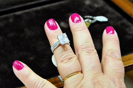 Lady hand showing a very valuable diamond ringの写真素材