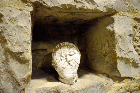 Sculpture of a head in the catacombs of the old town hall of Pragueの写真素材