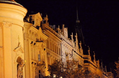 Historic and famous church in the city of Prague at nightの写真素材