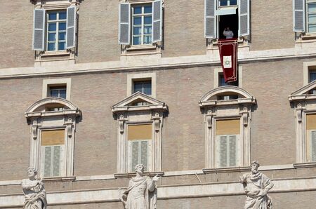 Pope in the window of the Vatican Library over St. Peter's Squareの写真素材