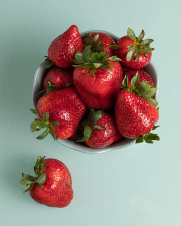 Fresh strawberries in a bowl, a healthy snack. An organic and ecological product.