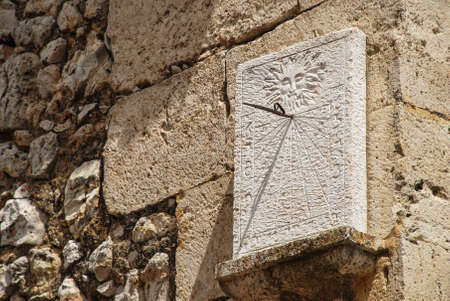 antique sundial made of stoneの写真素材