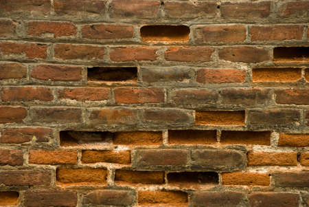 old wall with broken bricks