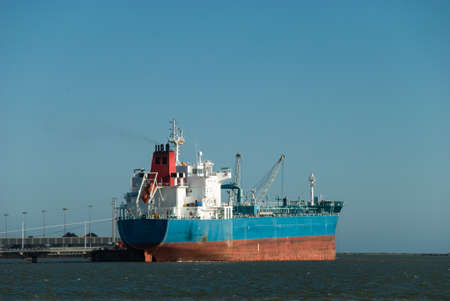 merchant ship docked in portの写真素材