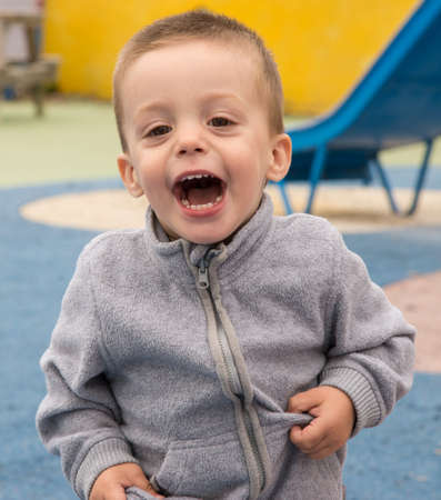 Portrait of a child shouting of happinessの写真素材