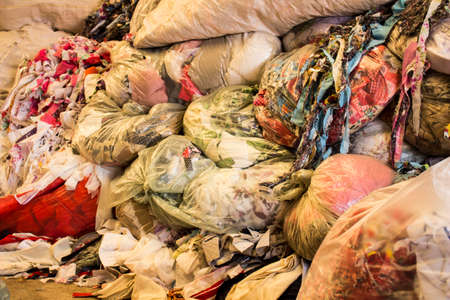 Fabric storage with diverse types and colors of fabrics and inside plastic bagsの写真素材