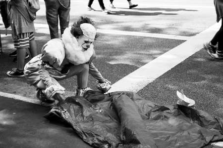 SÃ£o Paulo / SÃ£o Paulo / Brazil - 08 19 2018: Street clown full costume with makeup setting up...
