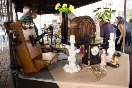 Sao Paulo / SP / Brazil - 01 03 18: Flea market with various objects and people near the stuff.