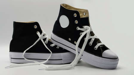 vintage black boots on white backgroundの写真素材