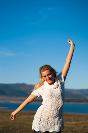 Girl Is Smiling On A Lakeの写真素材