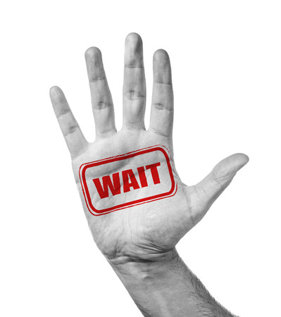 Male Hand With Stamp Wait, Isolated Over Whiteの写真素材