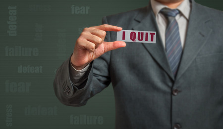 Business man in suit show card with text - I quit