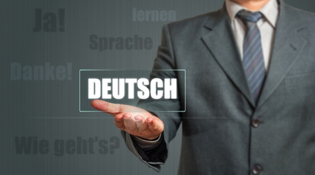 Business man Showing German Language Labelの写真素材