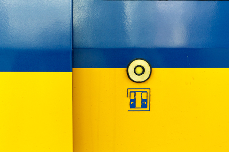 Exit door of the train with a button to automatically open the door on demand when the train stops.の写真素材