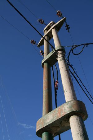 Electricity pylon in front of a blue skyの写真素材