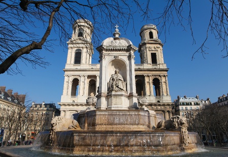 Fountain of Saint Sulpice (created in 1844) and the church Saint Sulpice; the second largest church in Paris, France.の写真素材