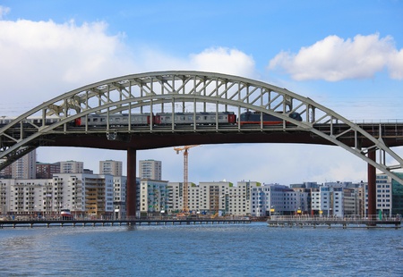 Railway Bridge with a train crossing over the water in Stockholm, capital of Sweden.の写真素材