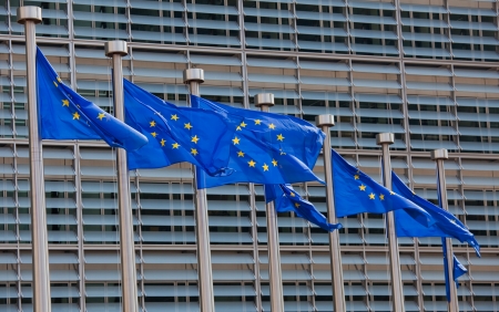 European flags in front of the Berlaymont building, headquarters of the European commission in Brussels のeditorial素材