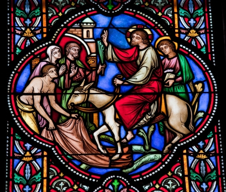 Jesus enters Jerusalem on a donkey on Palm Sunday. This window was created in 1866, no property release is required.のeditorial素材