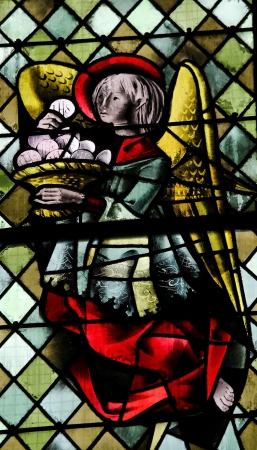 Angel with a Eucharist on a stained glass in the cathedral of Rouen, France, on February 10, 2013. This window was created more than 500 years ago, no property release is required.のeditorial素材