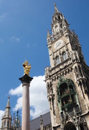Neues Rathaus, the new town hall, and the column of Saint Mary, on the Marienplatz in the old town of Munich, capital of Bavaria, Germany  All visible statues and inscriptions were created more than 100 years ago, no property release is required の写真素材