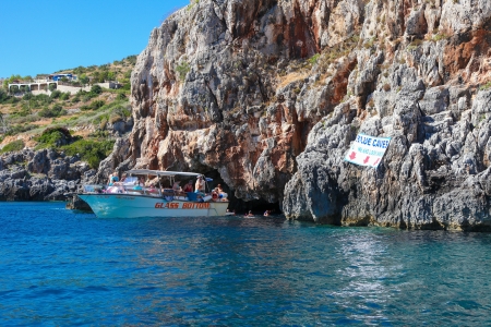 ZAKYNTHOS, GREECE - SEPT 21: Unidentified tourists at the famous blue caves in Zakynthos, Ionian islands, Greece, on September 21, 2013.のeditorial素材