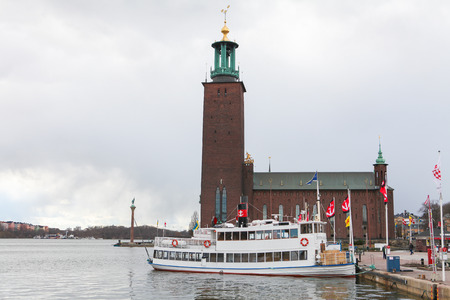 STOCKHOLM, SWEDEN - APRIL 18: Town Hall (Stadshuset) on King's Island in Stockholm, Sweden, on April 18, 2010, on the shores of the RiddarfjÃ¤rd, great landmark and emblem of the Swedish capital のeditorial素材