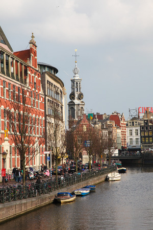 AMSTERDAM, THE NETHERLANDS - MARCH 25, 2011: View on the Singel canal and the famous Munt tower in Amsterdam, The Netherlands.のeditorial素材